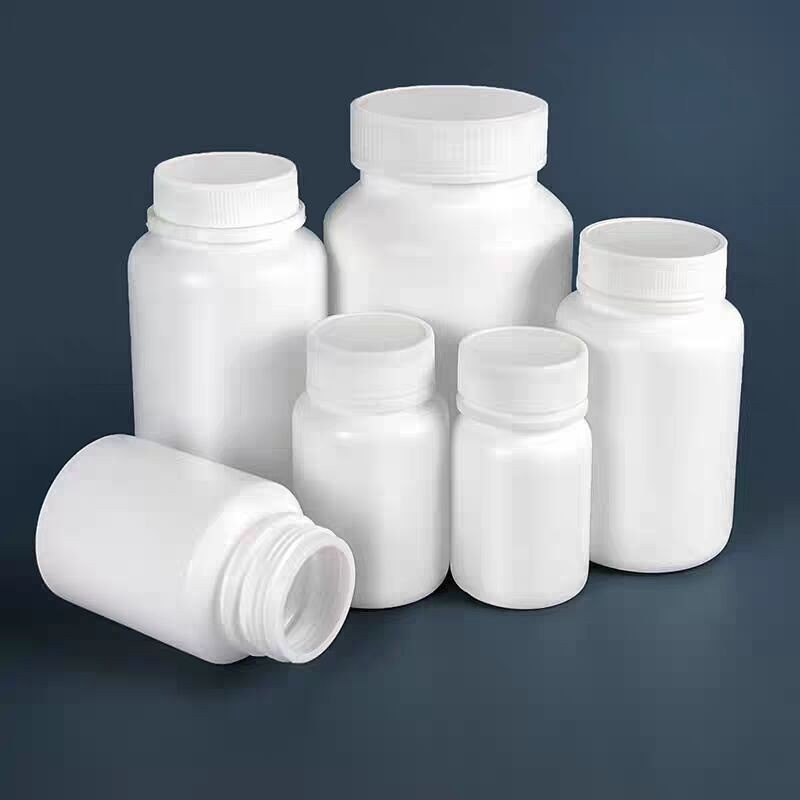 White solid bottles, 30g, 50g, 100g, pharmaceutical wide-mouth plastic bottles, powder/capsule dispensing bottles with caps.