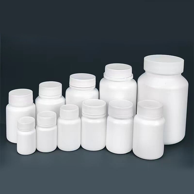 White solid bottles, 30g, 50g, 100g, pharmaceutical wide-mouth plastic bottles, powder/capsule dispensing bottles with caps.