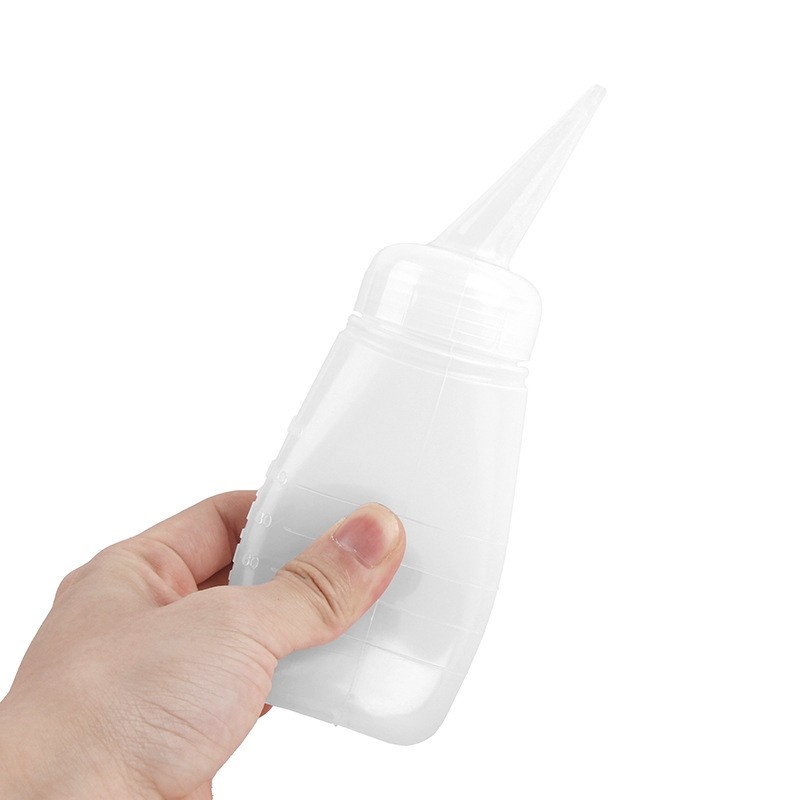 Factory wholesale graduated slanted spout shampoo bottles, beauty and hair care bottles, plastic dry cleaning bottles